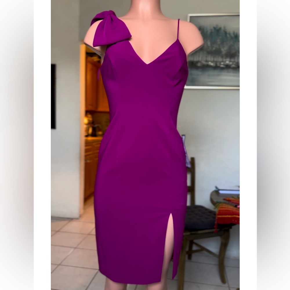 An oversized bow at the shoulder adds timeles Color: Wild Orchid Size4